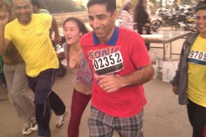 Runners taking part in a marathon, organised by the Classic Road Runners Athletic Club of Bangalore, which aimed to raise awareness about human rights abuses in Iran, 9 December 2012.
