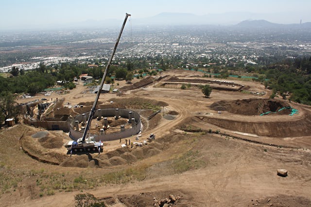 The construction site for the Baha'i House of Worship in Santiago, Chile, showing the partially completed basement, service tunnel, and excavation work.