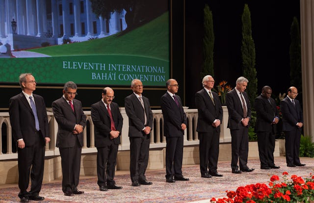 The members of the Universal House of Justice are, from left to right, Paul Lample, Firaydoun Javaheri, Payman Mohajer, Gustavo Correa, Shahriar Razavi, Stephen Birkland, Stephen Hall, Chuungu Malitonga, and Ayman Rouhani. They were elected by delegates to the 11th International Baha'i Convention in Haifa.