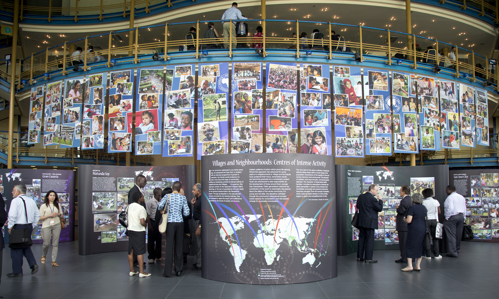 In the foyer of the Convention Centre in Haifa, visitors viewed an exhibition highlighting activities of Baha'i communities in diverse parts of the world.