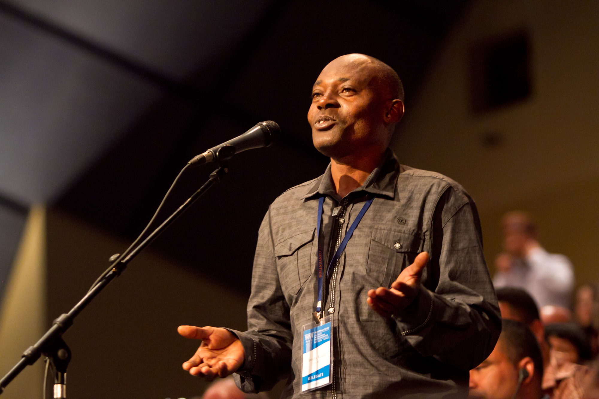 One National Spiritual Assembly representative shares thoughts with his fellow delegates at the 11th International Baha'i Convention.