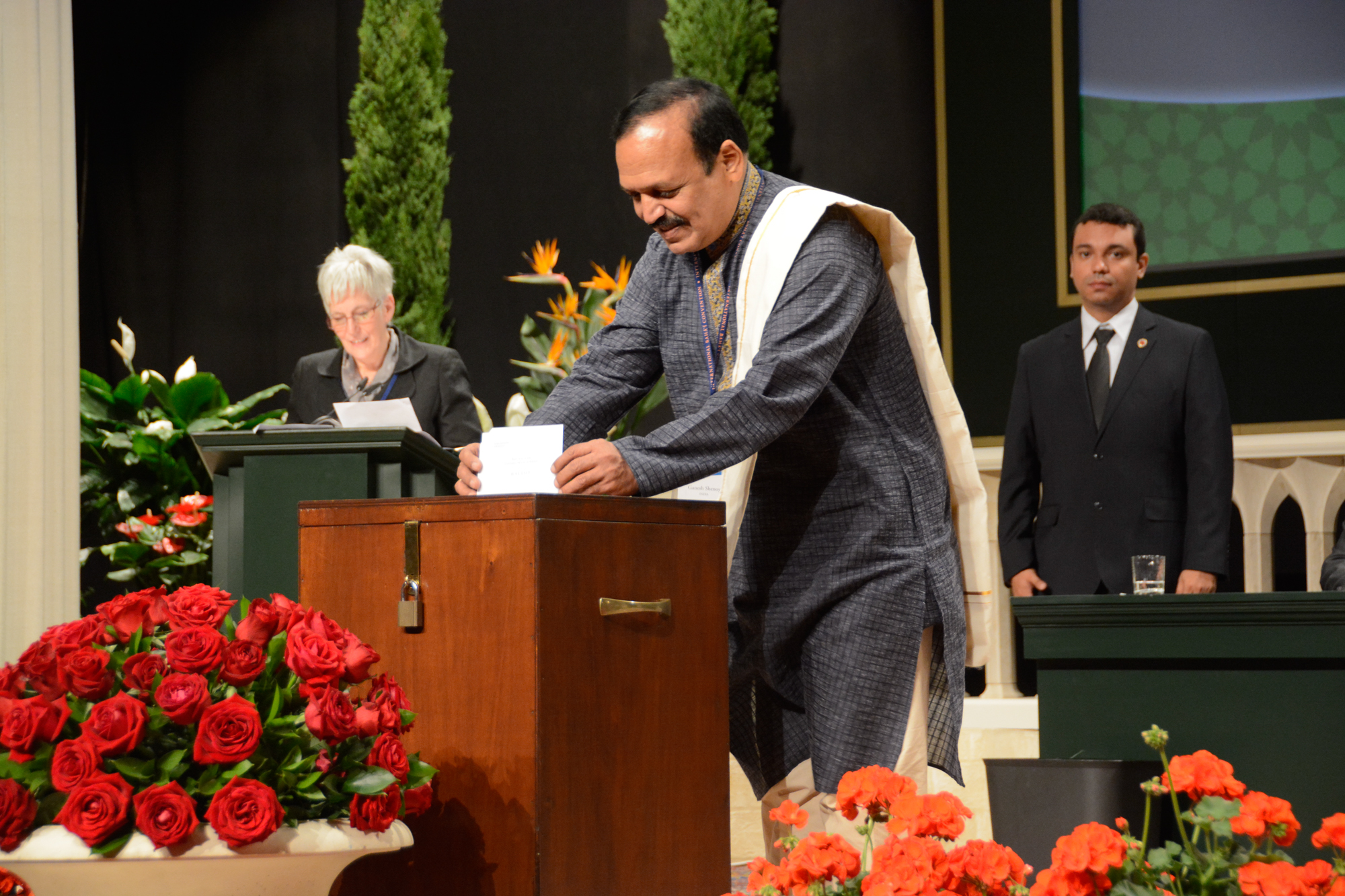 A delegate casts his vote in the election of the Universal House of Justice.