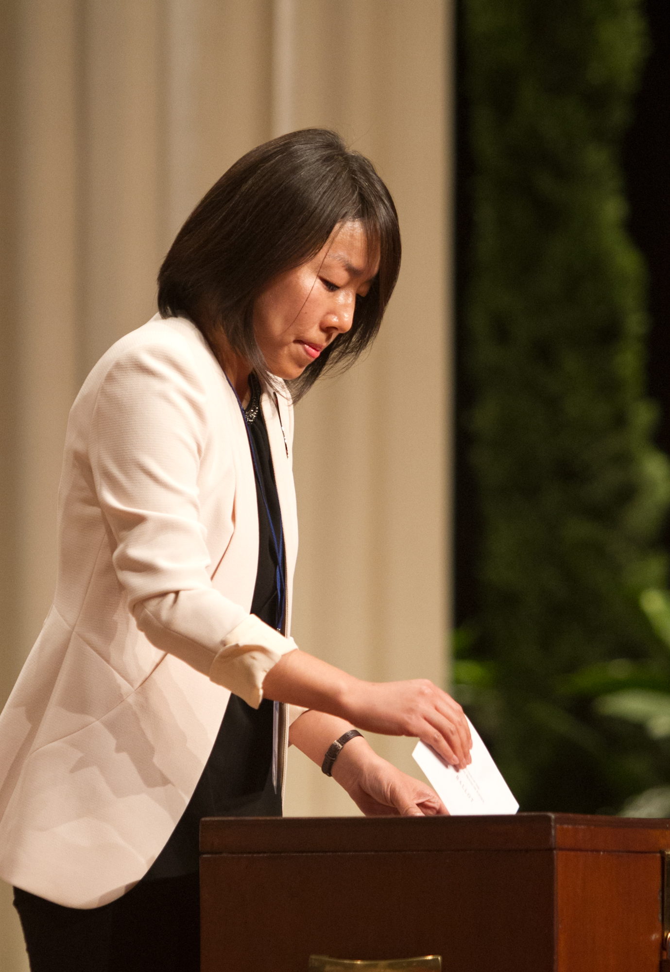 A delegate casts her vote in the election of the Universal House of Justice.
