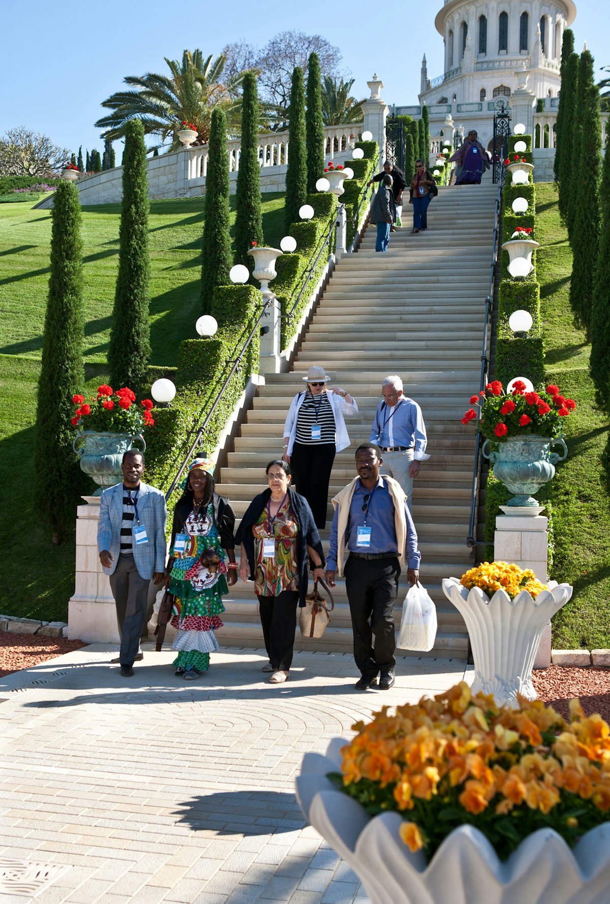 Prior to the opening of the 11th International Baha'i Convention, delegates had the opportunity to visit the Faith's holy places in Haifa and Acre. Here, representatives of National Spiritual Assemblies descend the garden terraces beneath the Shrine of the Bab.