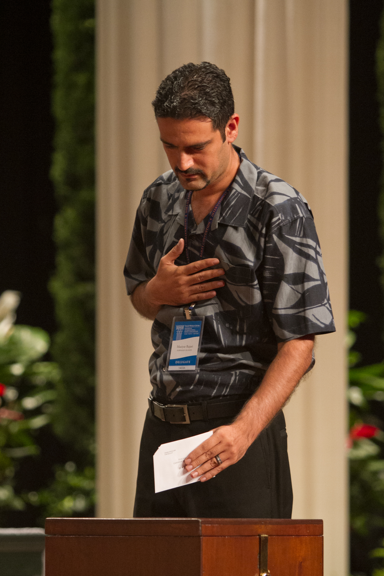 A delegate casts his vote in the election of the Universal House of Justice.