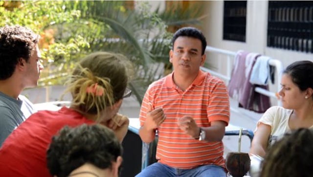 A group consults in the vicinity of the construction site for the House of Worship for the South American continent.
