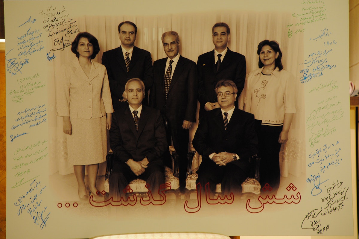 A large photo of the seven former Baha'i leaders signed by those present at the gathering. Some of these read as follows: 1. Dear Yaran of Iran, My dear compatriots, Be steadfast. We stand by you. [signed:] Nasrin Sotoudeh May 20142. In the Name of God, the all-Merciful, the Compassionate, In memory of the imprisoned Yaran, fair-minded men and women of Iran. Although you are in prison, you are amongst the noble-minded and illustrious truly free people of our land. [signed:] Nargess Mohammadi 15 May 20143. In the Name of God, the source of light and knowledge, and in memory of my imprisoned friends, the Yaran, with whom I spent memorable days and nights. Hoping for the release of all prisoners of conscience and political prisoners. [signed:] Issa Saharkhiz4. In the hope of the release of these beloved seven and all the prisoners of conscience and political prisoners. Hoping for a better Iran with equality for all Iranians. [signed:] Jila Bani-Yaghoub5. He is the Beloved, In memory of our dear ones who have suffered as the result of our ignorance, and in hope of a day when the light of the mind will illuminate our society. [signed:] Mohammad Nourizad 11 May 20146. On the eve of the celebration of the birth of Imam Ali, peace be upon Him, we gather here with the Bahá’ís to remember the words of Ali who taught: All humans are equal. [signed:] Dr. Maleki 11 May 2014