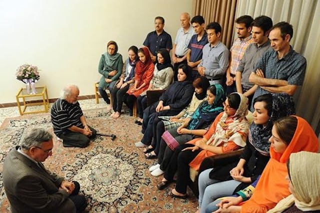 In a photograph posted earlier this month to several Persian-language websites, Muhammad Nourizad, a former journalist with the semi-official Kayhan newspaper, and Muhammad Maleki, the first head of Tehran University following the Islamic Revolution, are seen on their knees in humility before a group of Baha’i students.