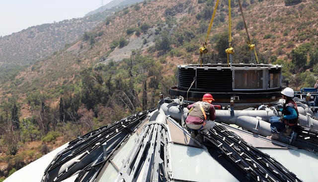 Construction workers install the oculus for the House of Worship for South America outside Santiago, Chile.