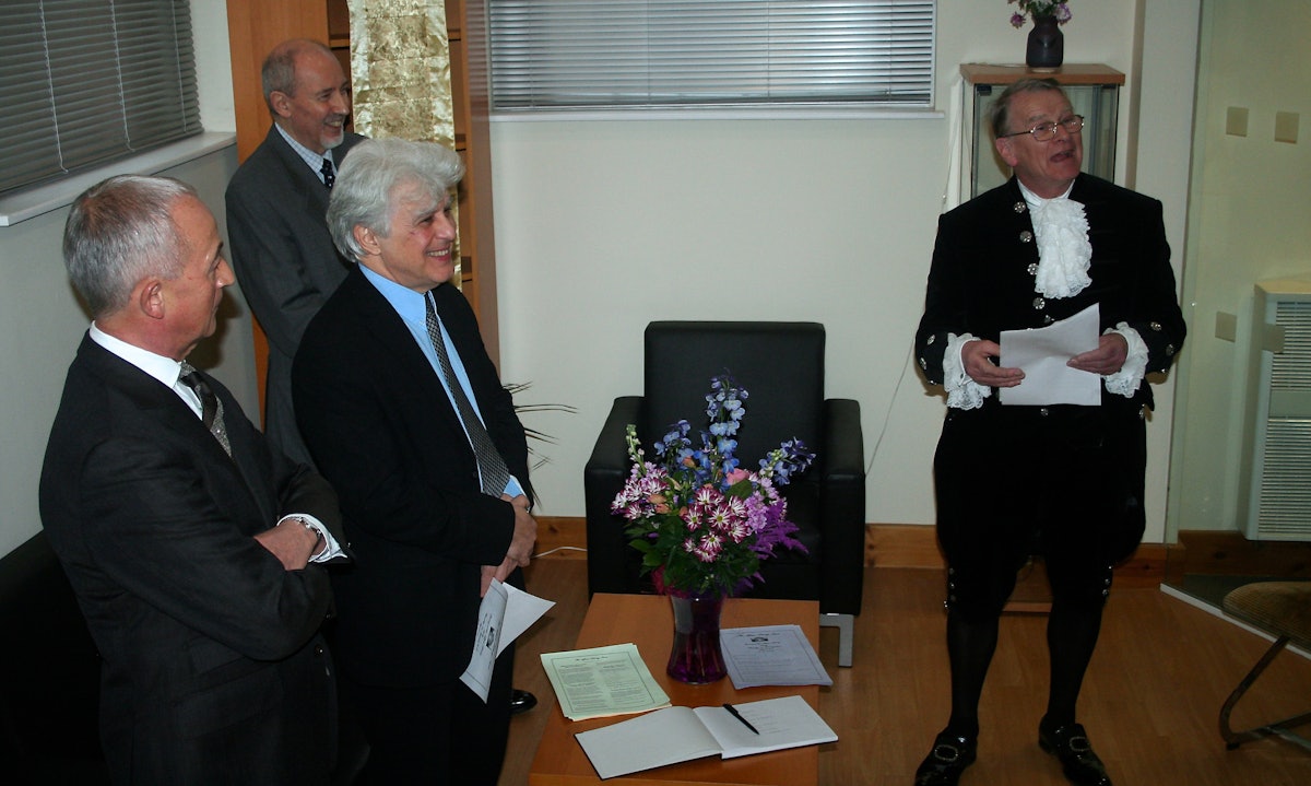 The High Sheriff of Bedfordshire, Colin Osborne, pictured right, officially opened the Afnan Library in Sandy, 12 February 2015, watched by Afnan Library Trust trustees Robert Balyuzi and Moojan Momen, and Barney Leith, representative of the National Spiritual Assembly of the Baha'is of the United Kingdom.