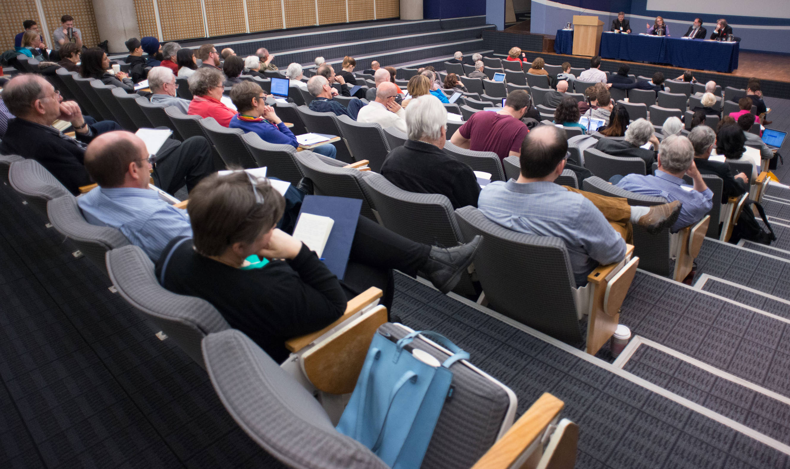 Participants listen intently during a panel discussion at the conference.