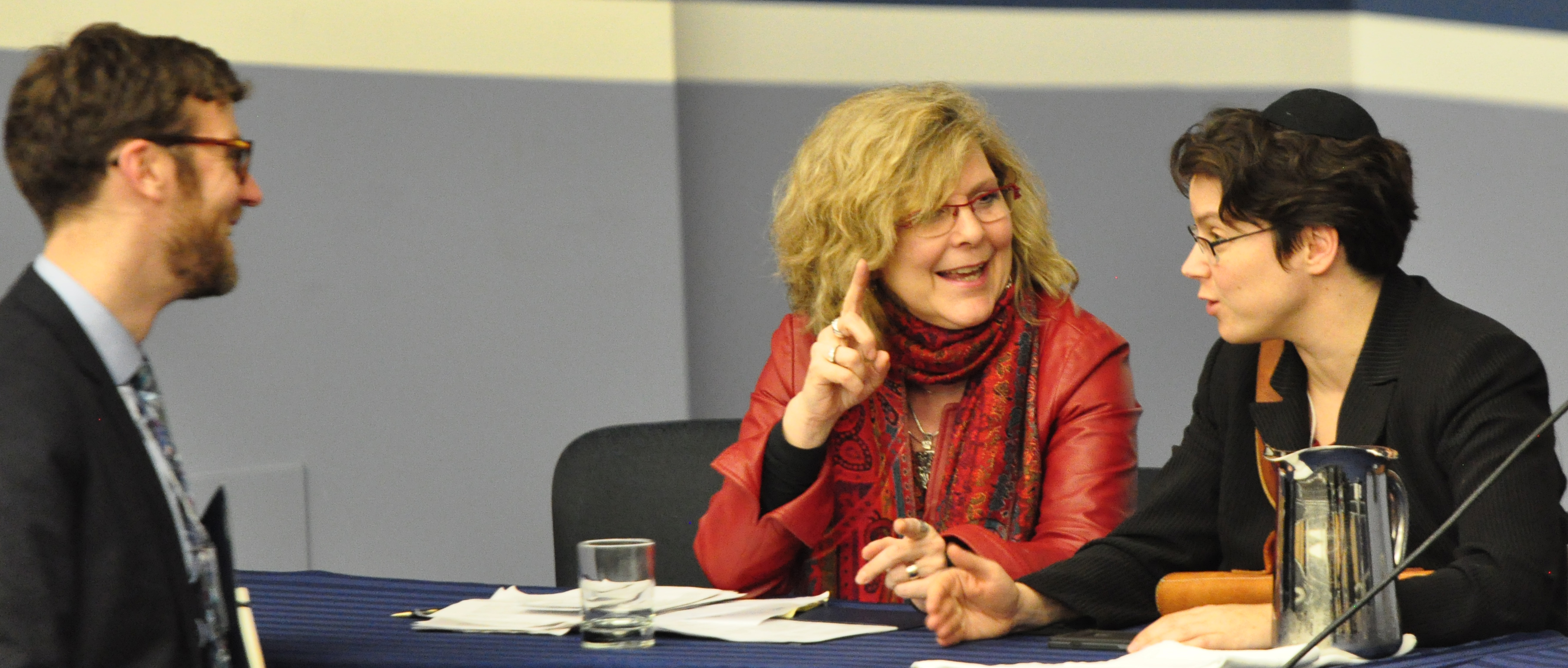 Geoffrey Cameron (left), Principal Researcher with the Baha'i Community of Canada; Reverend Karen Hamilton (center), General Secretary of the Canadian Council of Churches; and Rabbi Lisa Grushcow (right), from Temple Emanu-El-Beth Sholom in Montreal, converse between sessions at the conference.