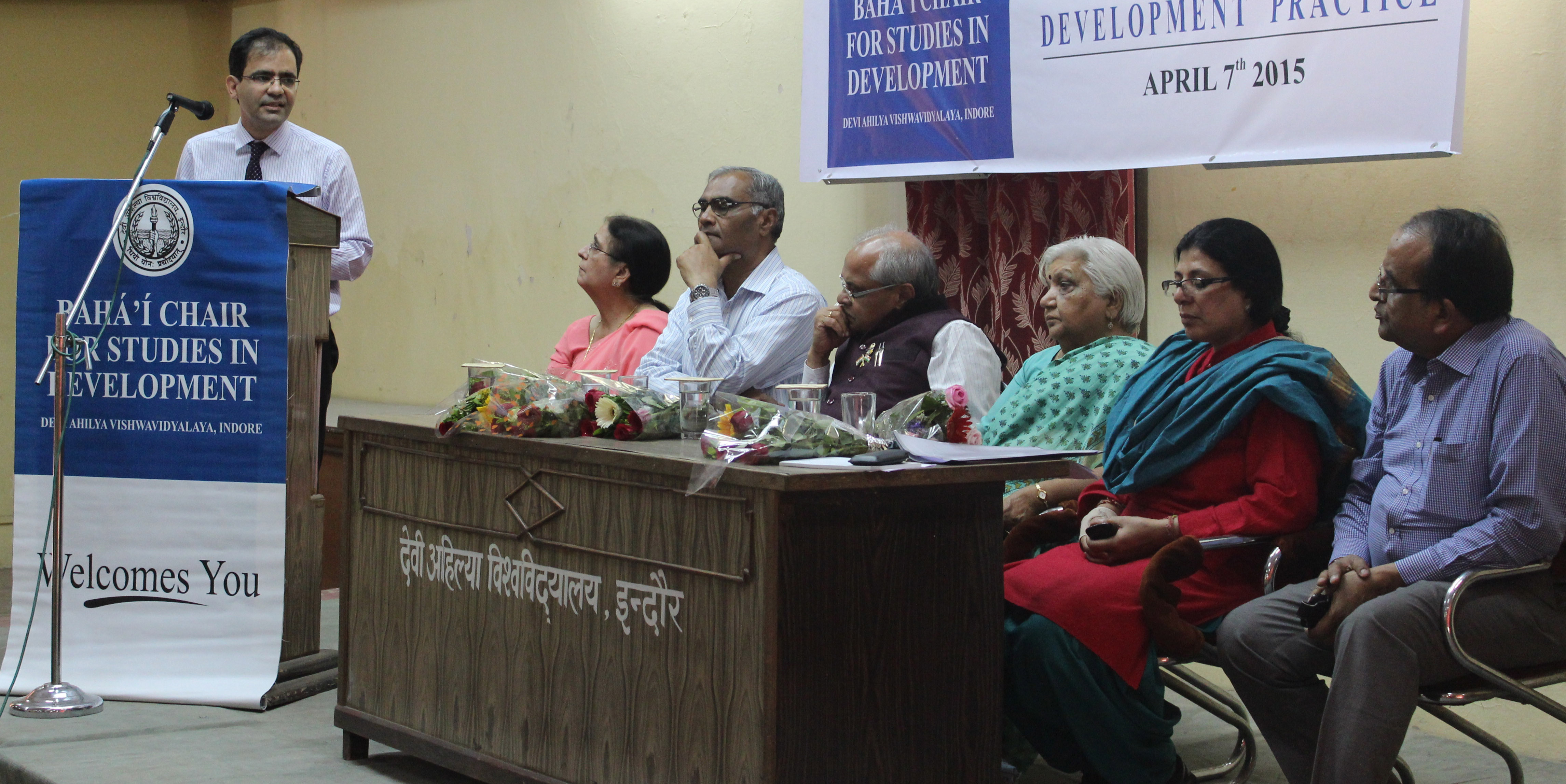 Dr. Arash Fazli (at the podium) presents at the seminar Applying Spiritual Principles and Scientific Methods to Development Practice, organized by the Baha'i Chair for Studies in Development at Devi Ahilya University in Indore, India.