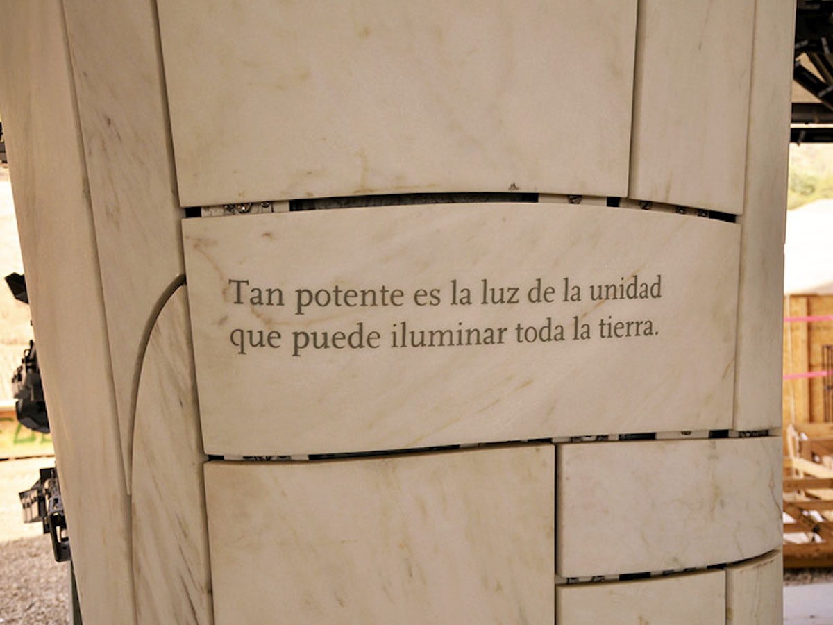 On a marble column of the superstructure, a well-known verse from Baha’u’llah is enscribed: “So powerful is the light of unity that it can illuminate the whole earth.”