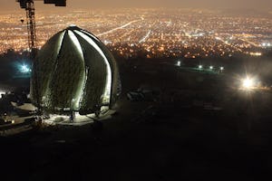 In the foothills of the Andes, the Baha’i House of Worship emerges, overlooking the city of Santiago