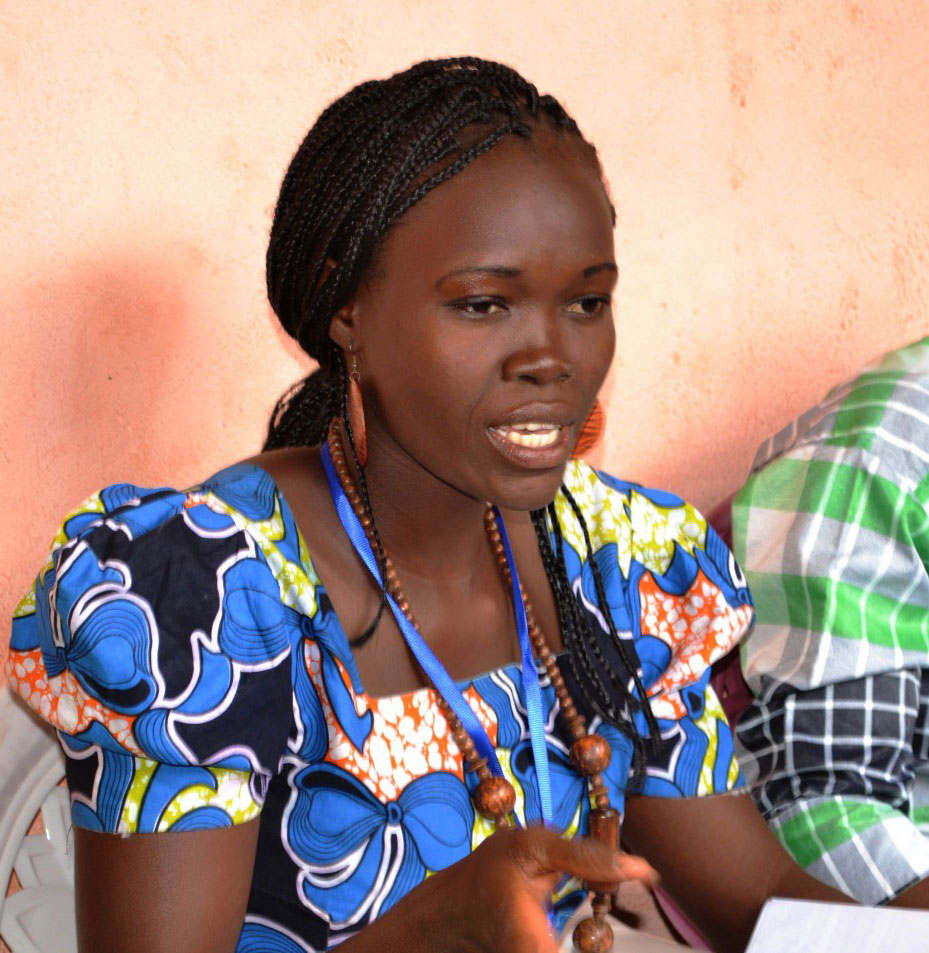 A participant contributes to the conversation in a small group session.