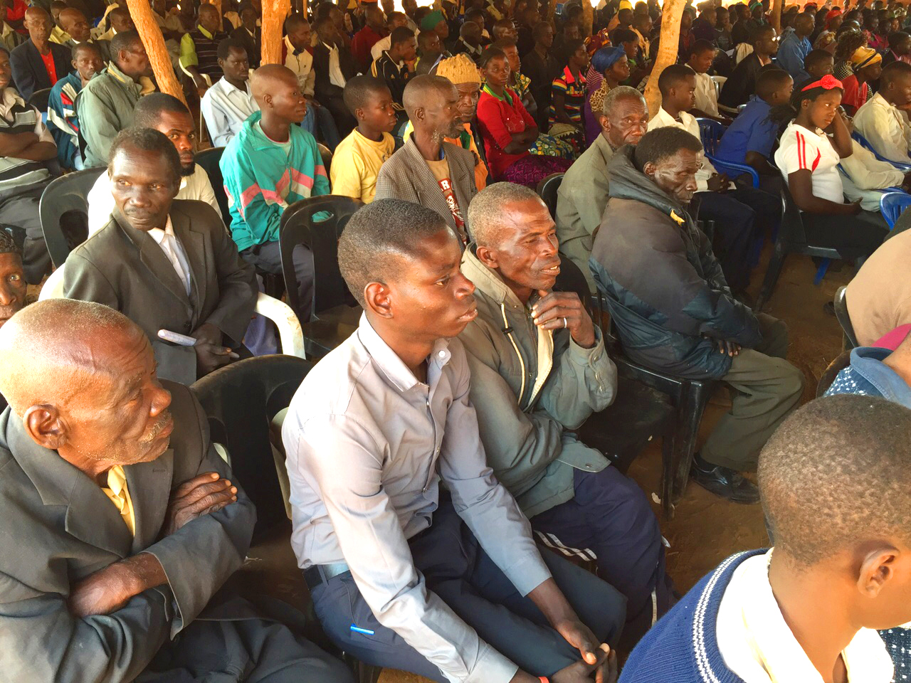 Participants, young and old, join together in a plenary session to reflect and consult