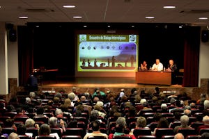 A panel of speakers at an interfaith conference titled "Interwoven by the Mercy of God" in Madrid.