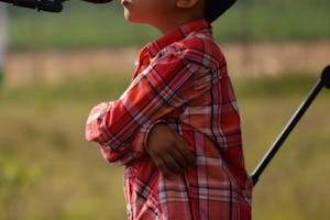 A young boy prays during the temple groundbreaking in Agua Azul on 22 May.