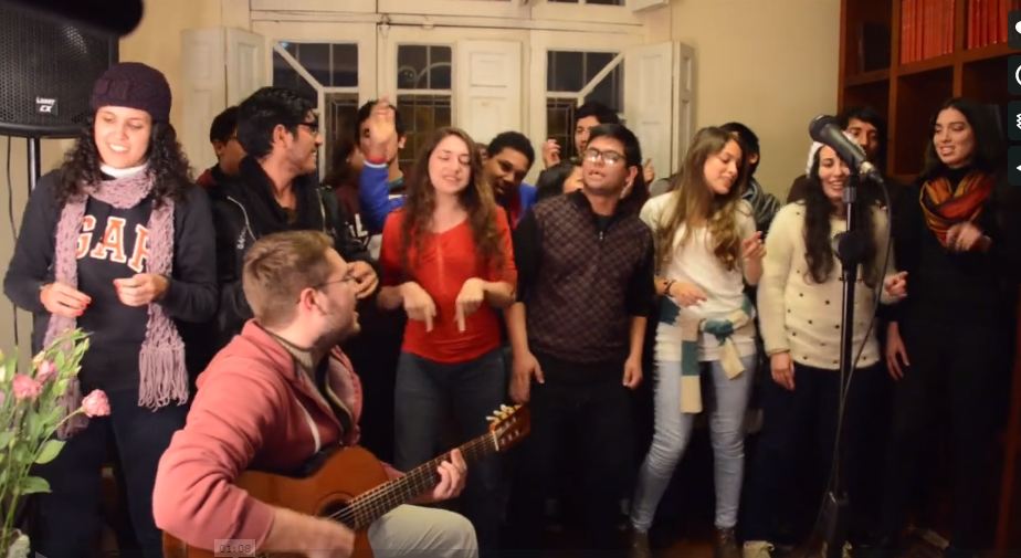 The video highlights the participation of youth in the processes set in motion by the construction of the Baha'i House of Worship. Here, young people serving at the Temple and from the surrounding community have gathered to play music.