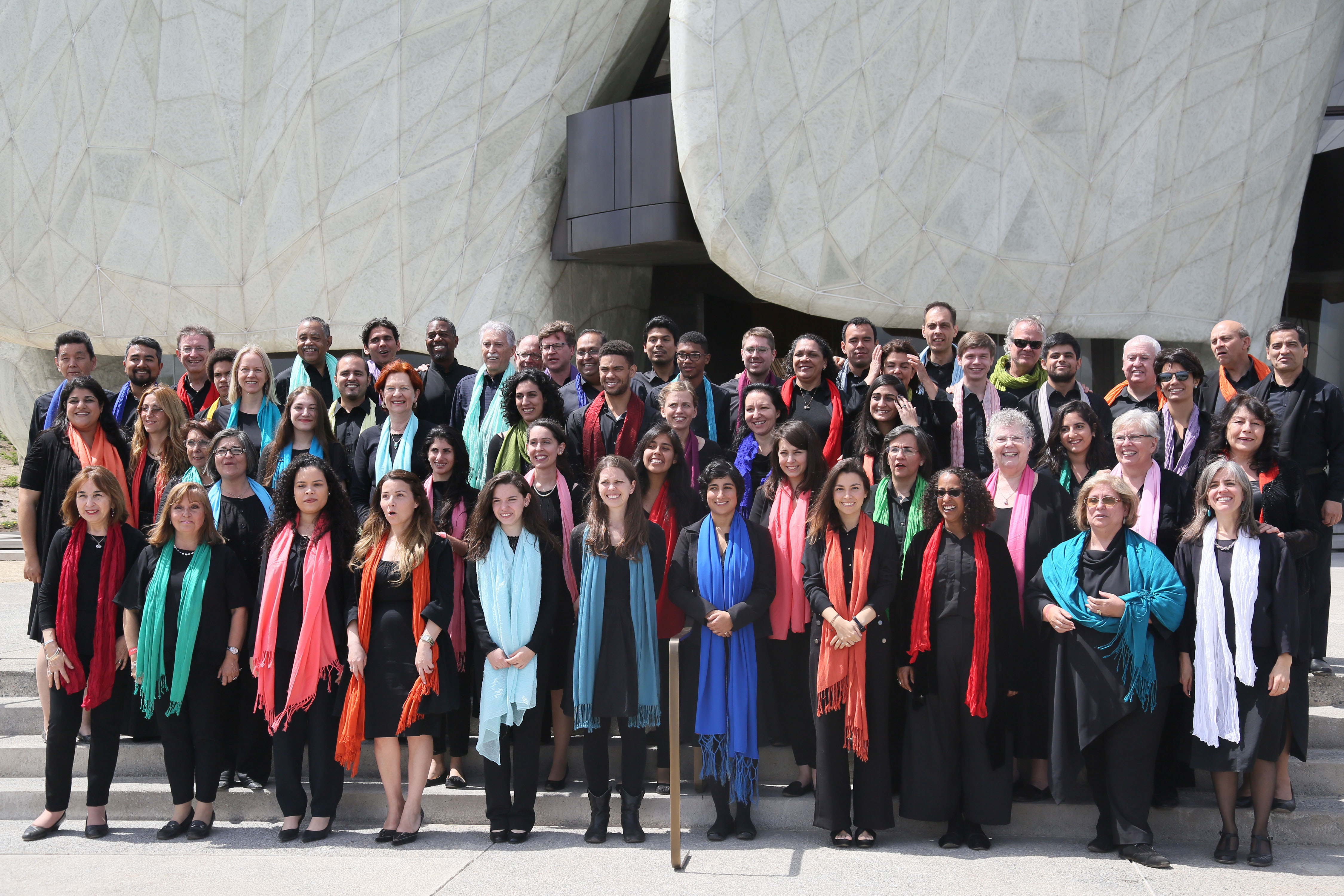 The choir, made up of singers from around the world, gathers outside of the House of Worship.
