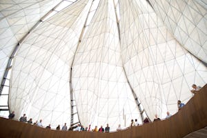 Visitors to the House of Worship in Santiago, Chile stand in the glass and marble wings of the Temple.