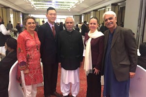 Representatives of the Baha'i International Community with the Secretary of Pakistan's Ministry of Religious Affairs (center) at the International Seerat Conference held in Lahore.