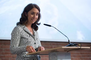 Aydan Ozoguz, Germany's State Minister of Immigration, Refugees, and Integration, speaking at an event co-hosted by the Baha'i community of Germany and the Anne Frank Foundation