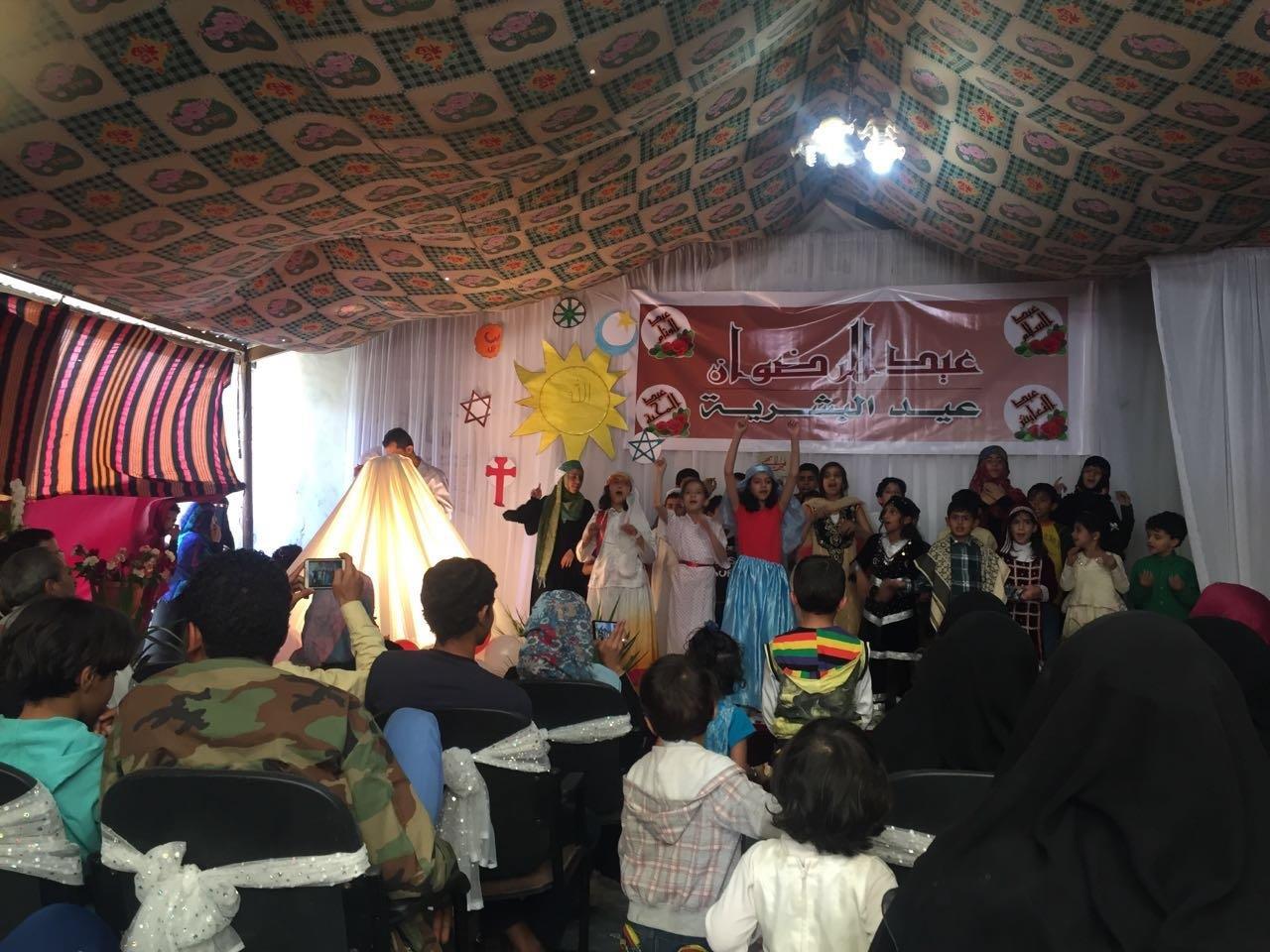 Children celebrating the commonalities of all faiths at a community event.