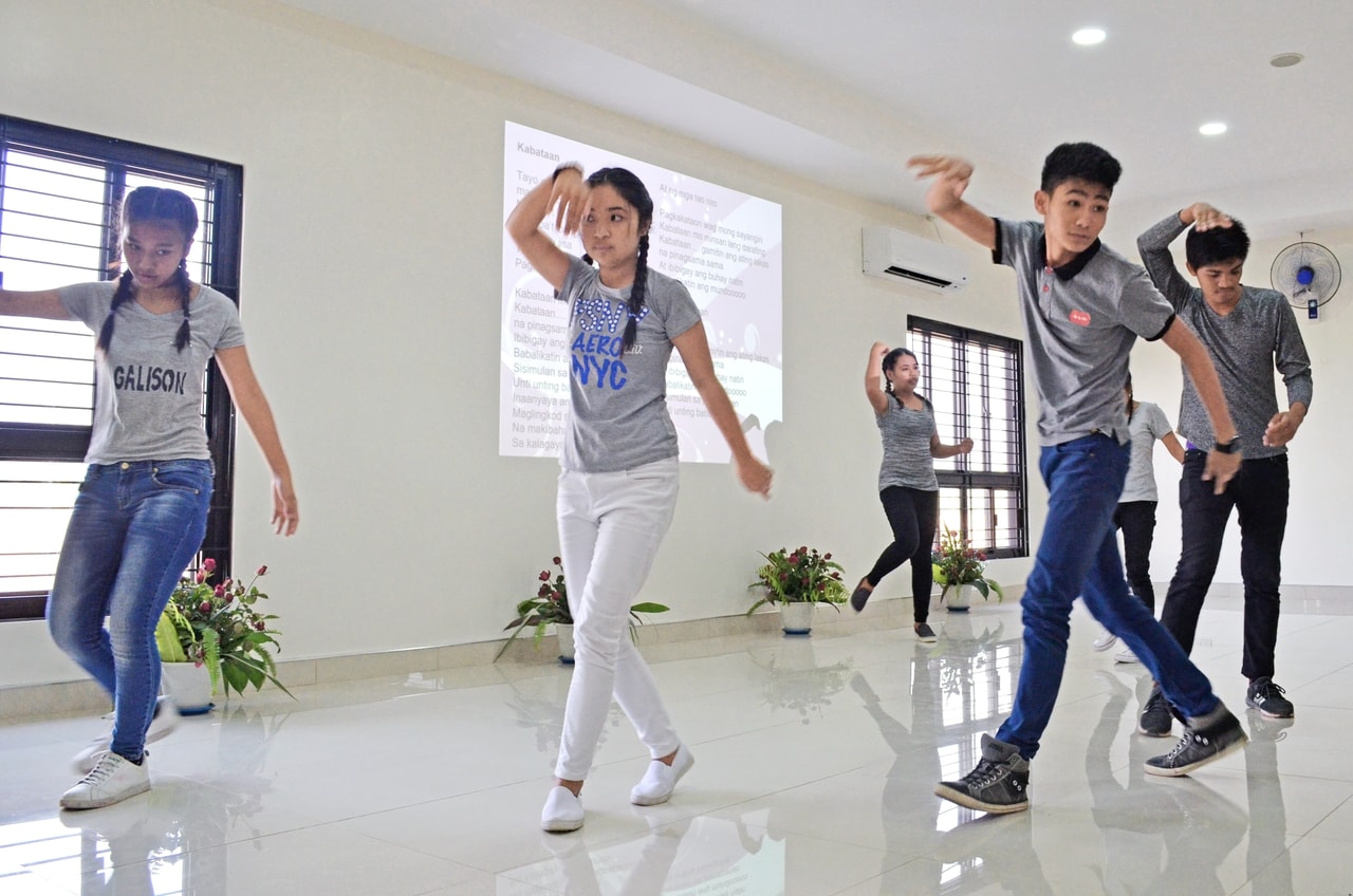 Youth perform a dance at a Ridvan celebration in Manila, Philippines.