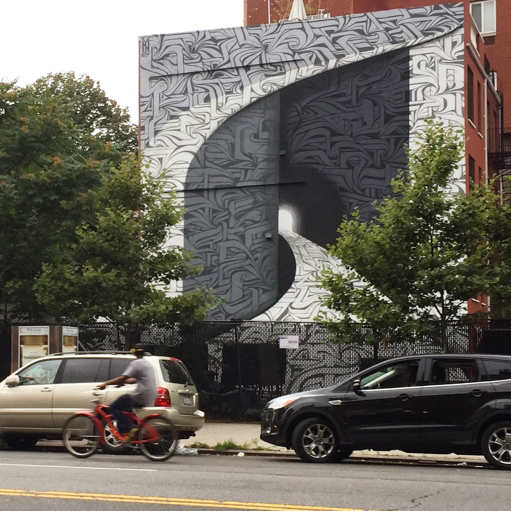 This mural by the French artist Astro depicts the famous gates of Tehran University in Iran, from which Baha'is are barred.