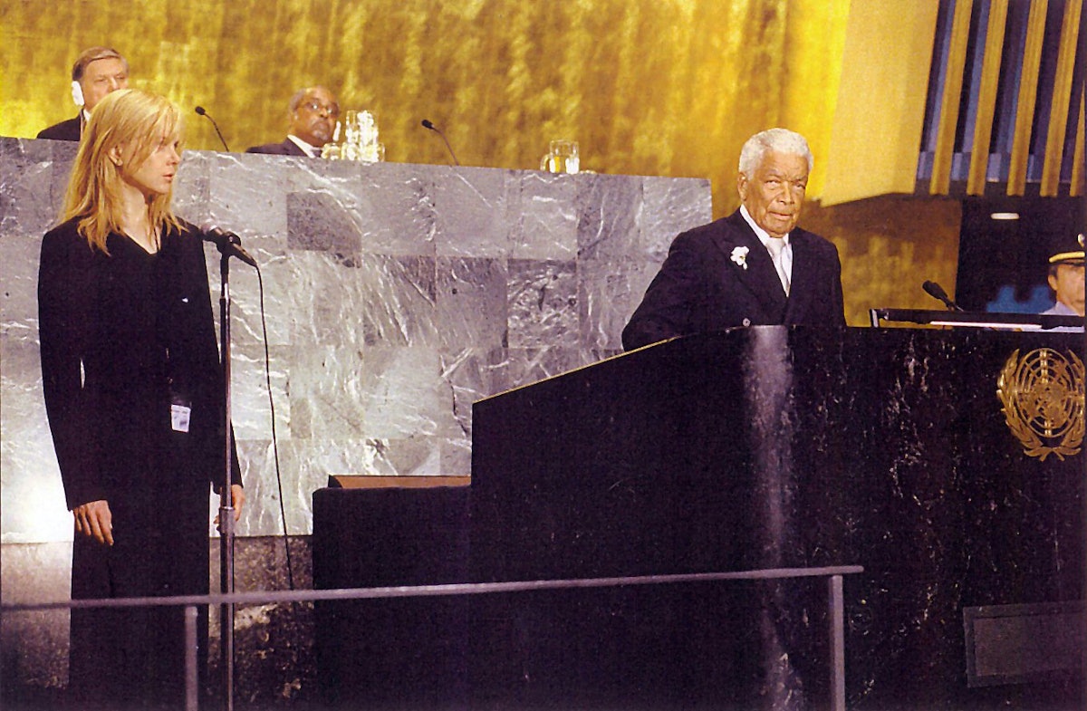 Earl Cameron played president of an African country in the movie The Interpreter (2005).  In this scene, he addresses the United Nations with Oscar-winning actress Nicole Kidman to his left. (Photo: Universal Studios)