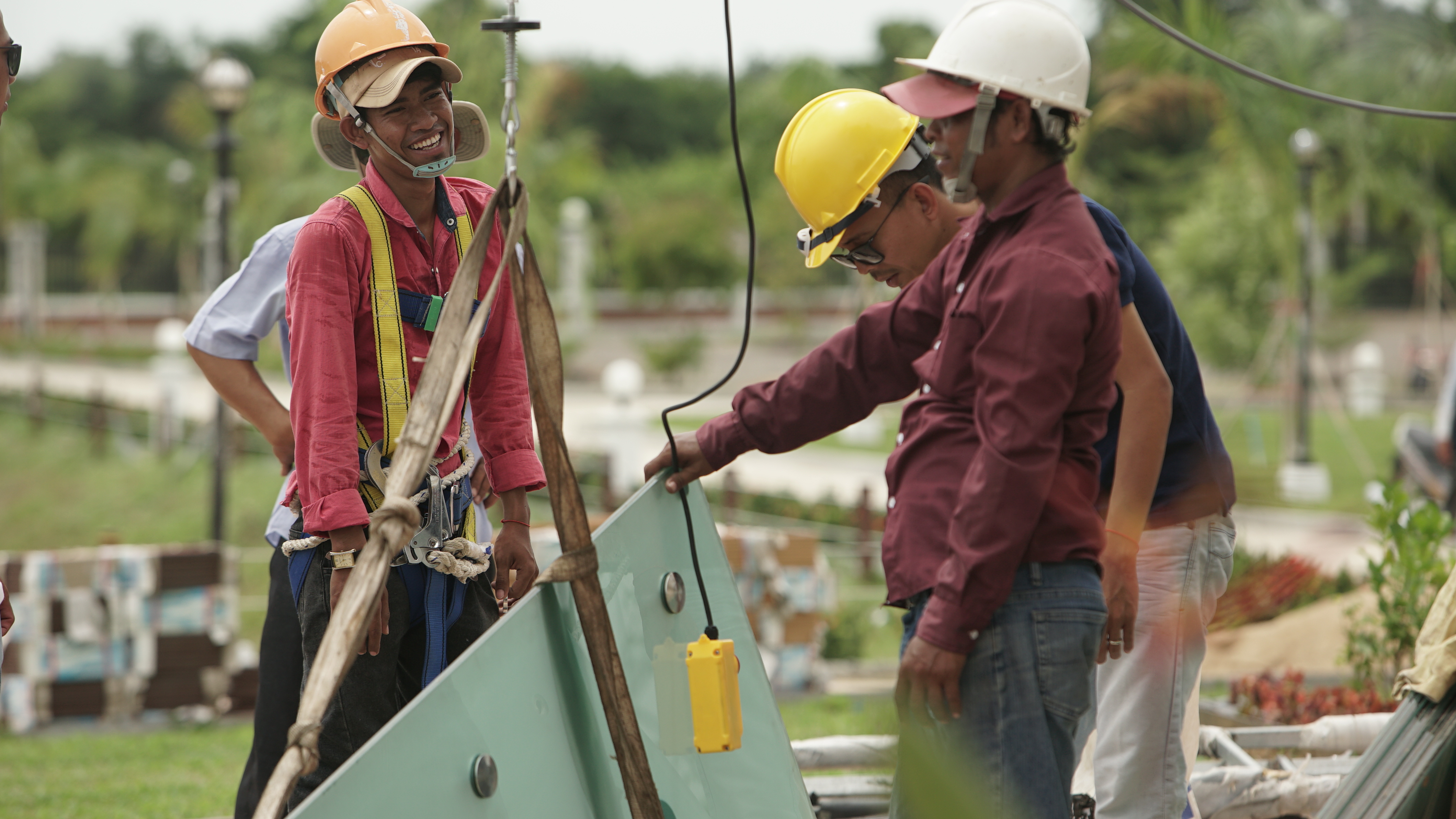 Workers finish the final construction of the Temple's skylight.