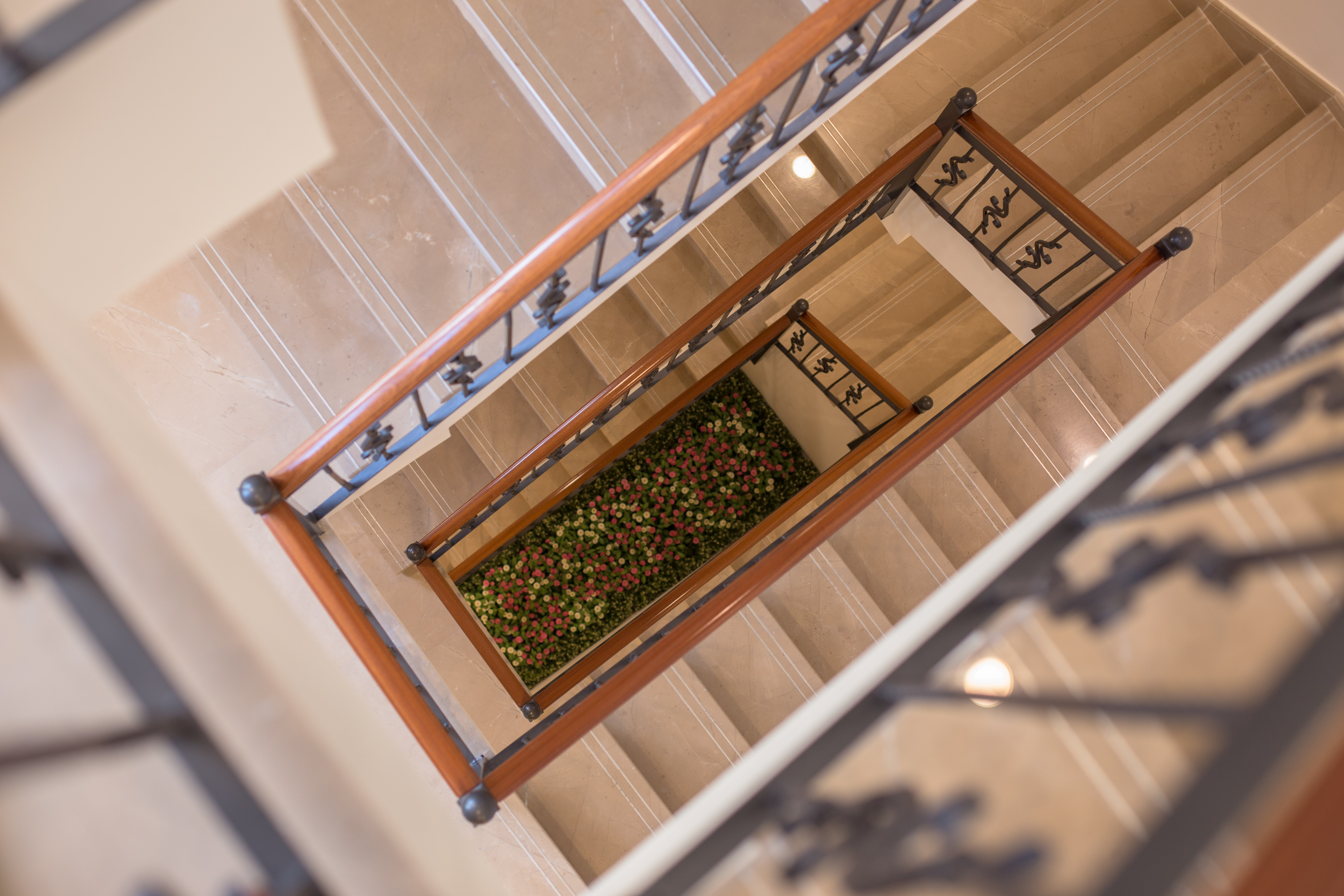 The three-story building has four floors, including a basement, which provides visitors and pilgrims a place to eat, rest, read, and talk.