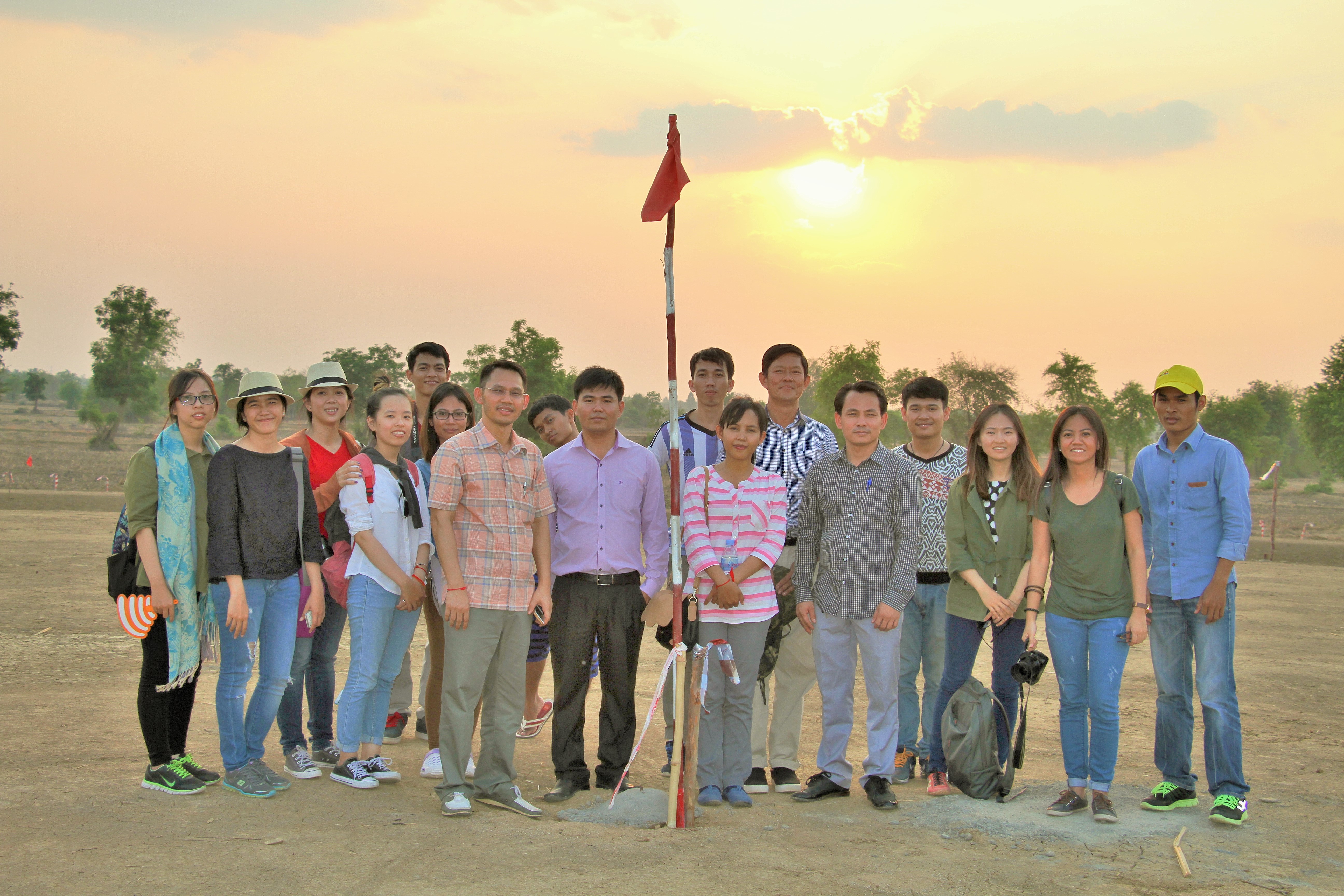 The staff of ADI and the project Team stand at the site of Battambang’s Temple before construction commenced.