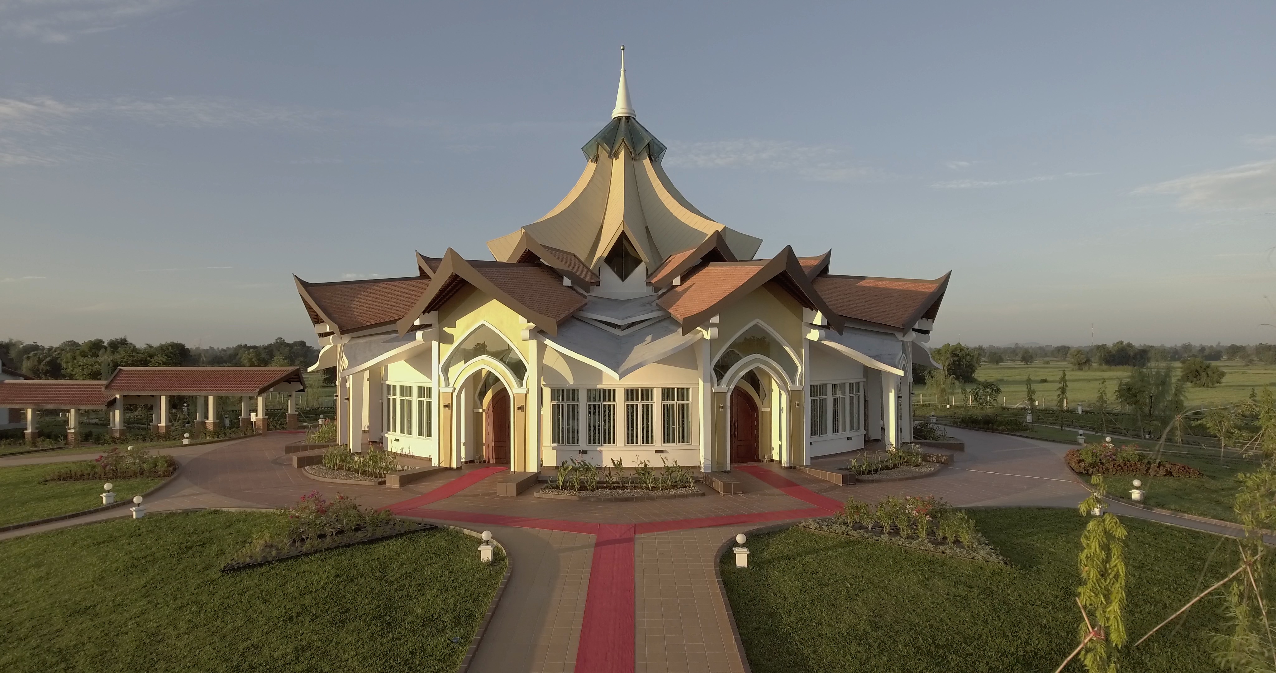 A red carpet marks the entry path for the groups of visitors to the Temple.