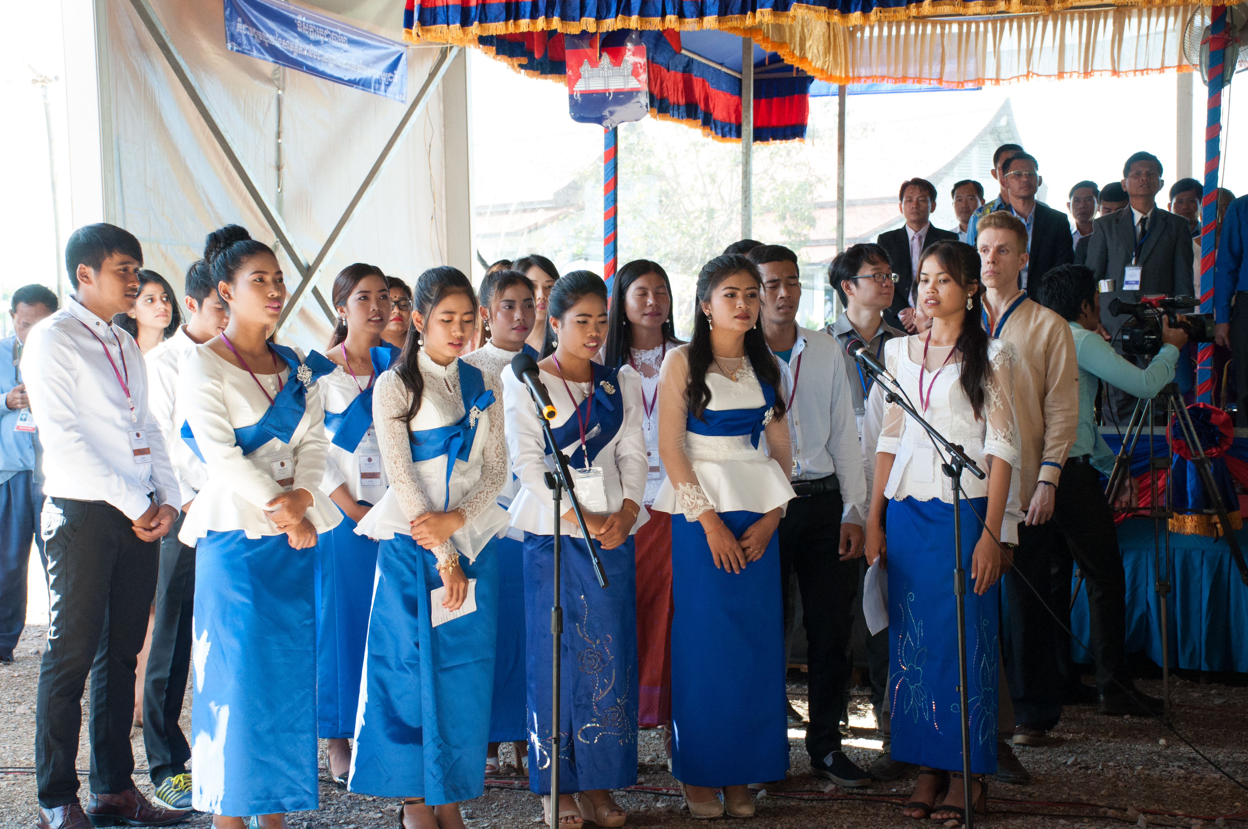 A group sings a devotional piece at the opening of the inauguration ceremony.