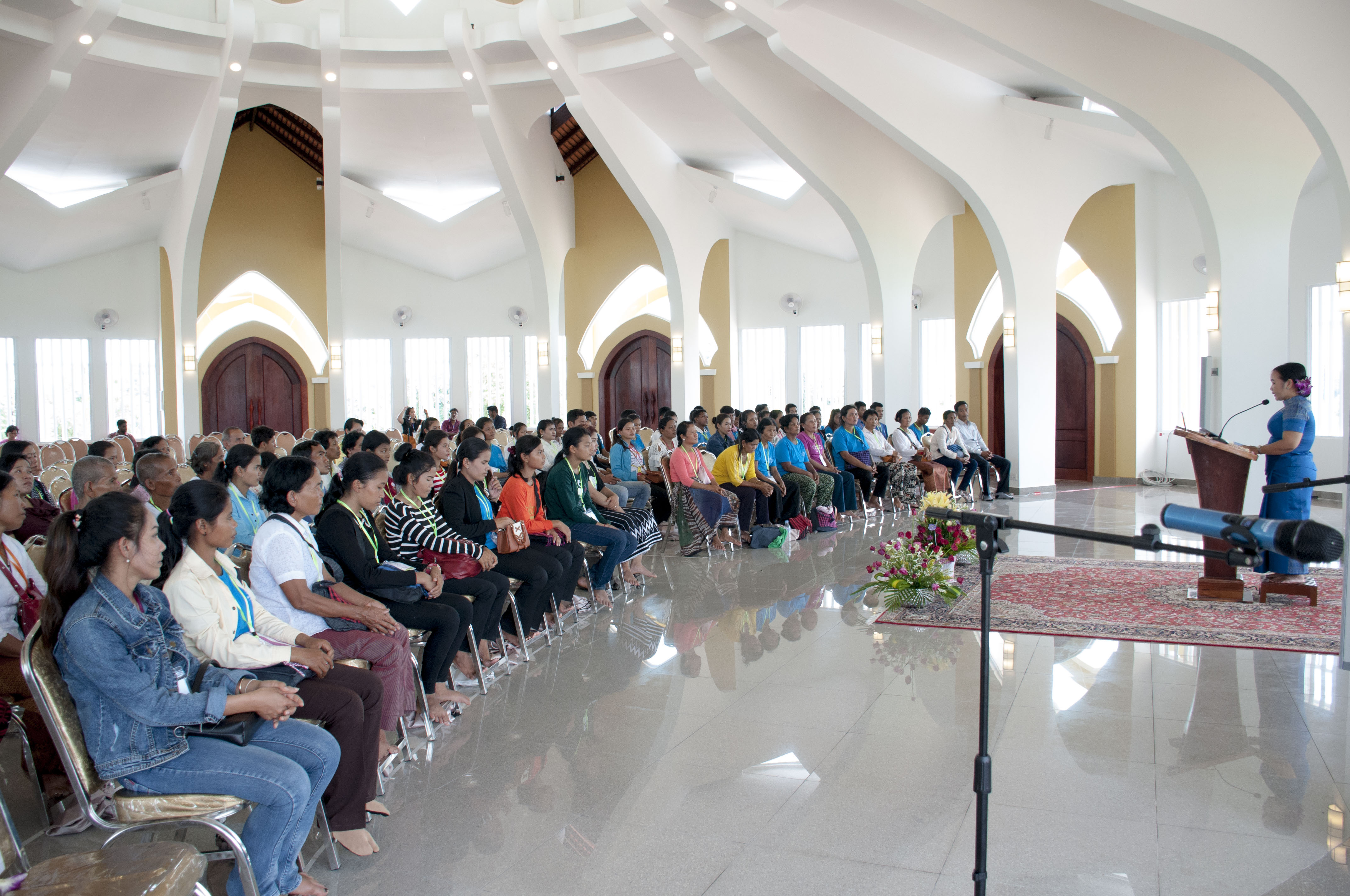 Representative of the Universal House of Justice for the dedication, Ms. Sokuntheary Reth, who is a member of the Continental Board of Counsellors for Asia, addresses visitors to the Temple.