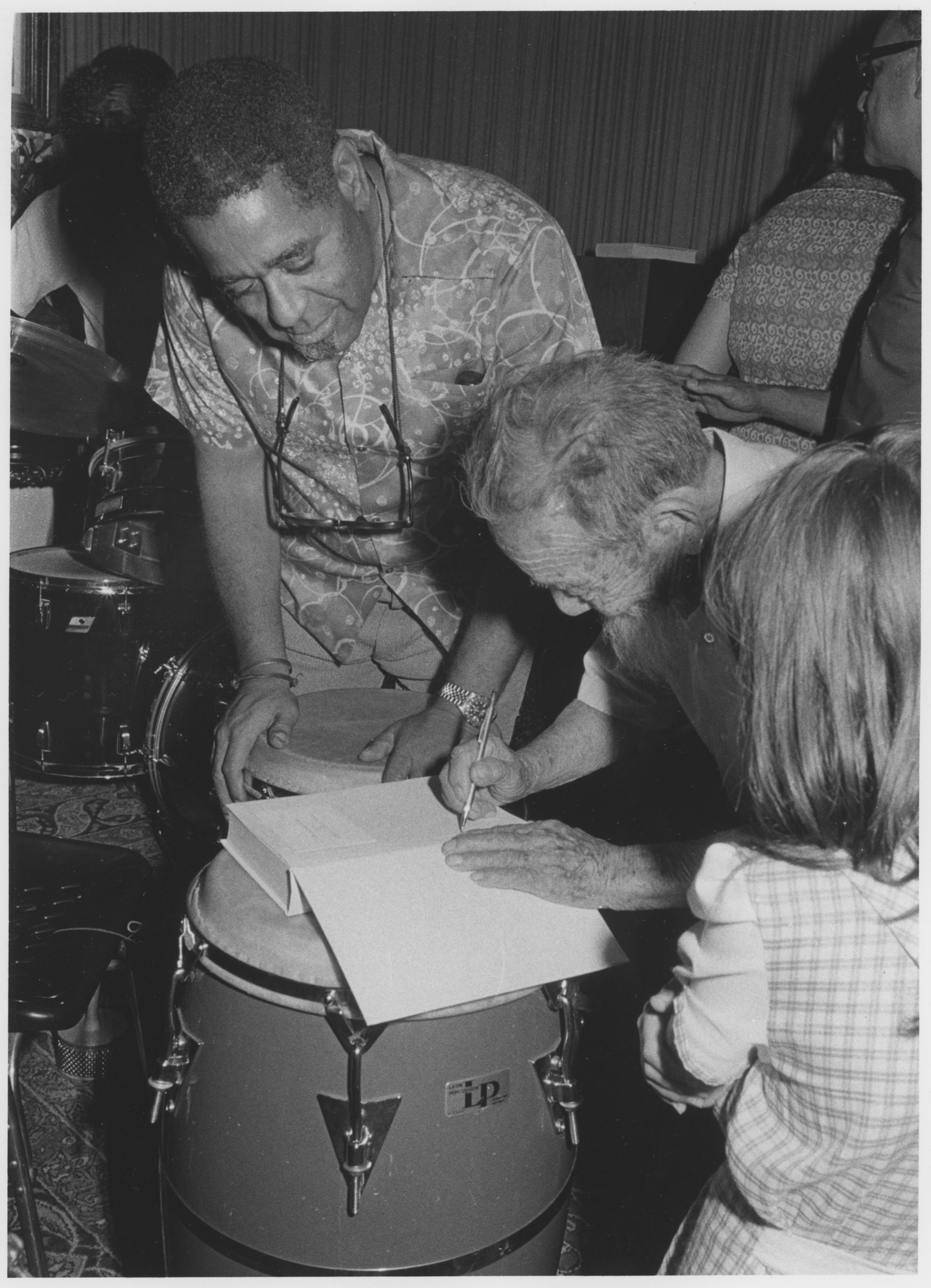 Saichiro Fujita signing a book of Dizzy Gillespie’s in 1975.