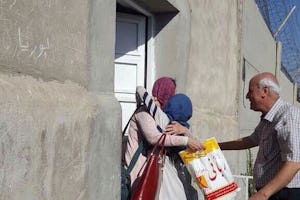 Fariba Kamalabadi leaving the prison where she was unjustly held for ten years. She is greeted by members of her family.