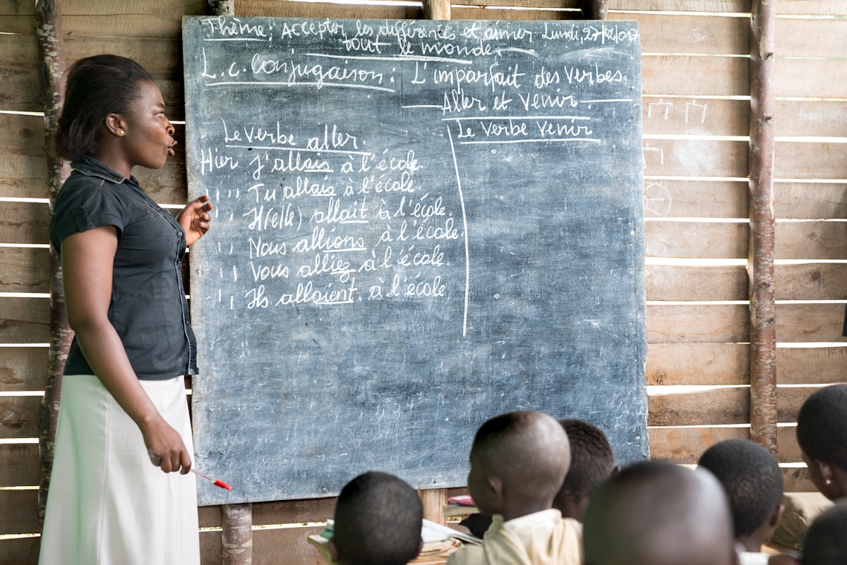 A teacher presents a lesson at a community school in Walungu, Democratic Republic of Congo.