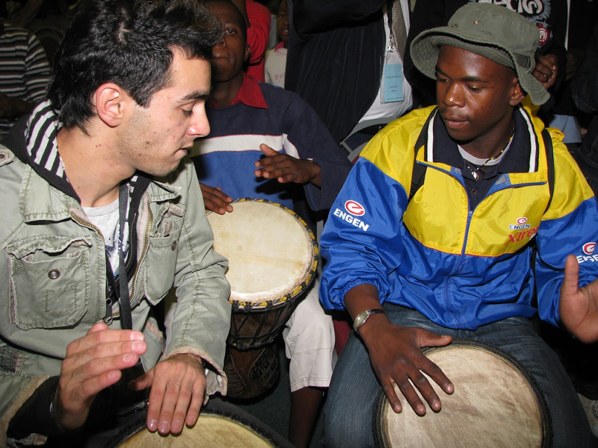 Two drummers get into the spirit at the Johannesburg conference.