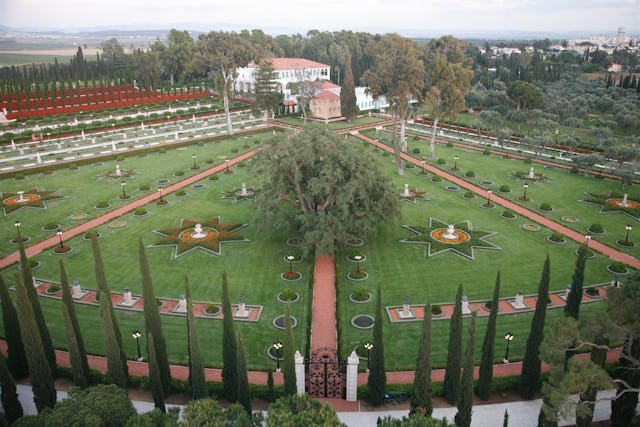 The burial place of Baha'u'llah and the adjacent house where He lived His final years are located in Acre, Israel. The shrine (the square darker building at the front of the complex) and gardens are open to the public.