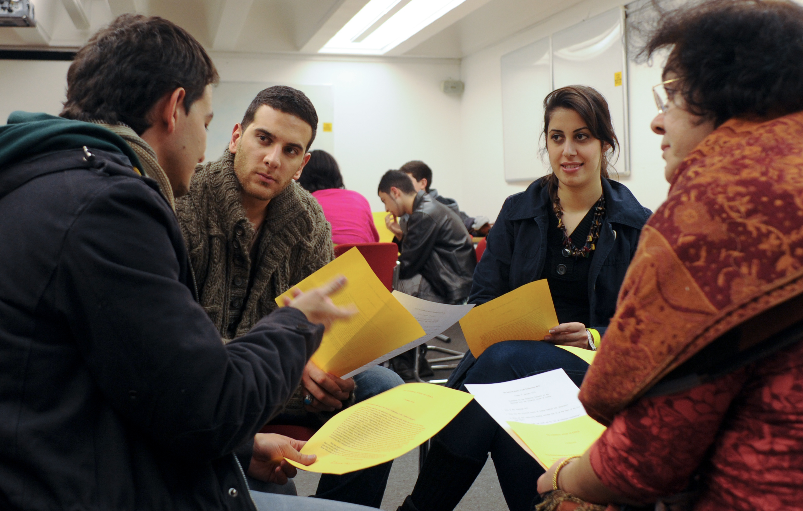 One theme of consultation at the UK youth gathering was a message from the Universal House of Justice. The message referred to the earnestness, energy, and “intrepid determination” of the youth. (Photograph by Ronnie Yousefzadeh-Bindra)