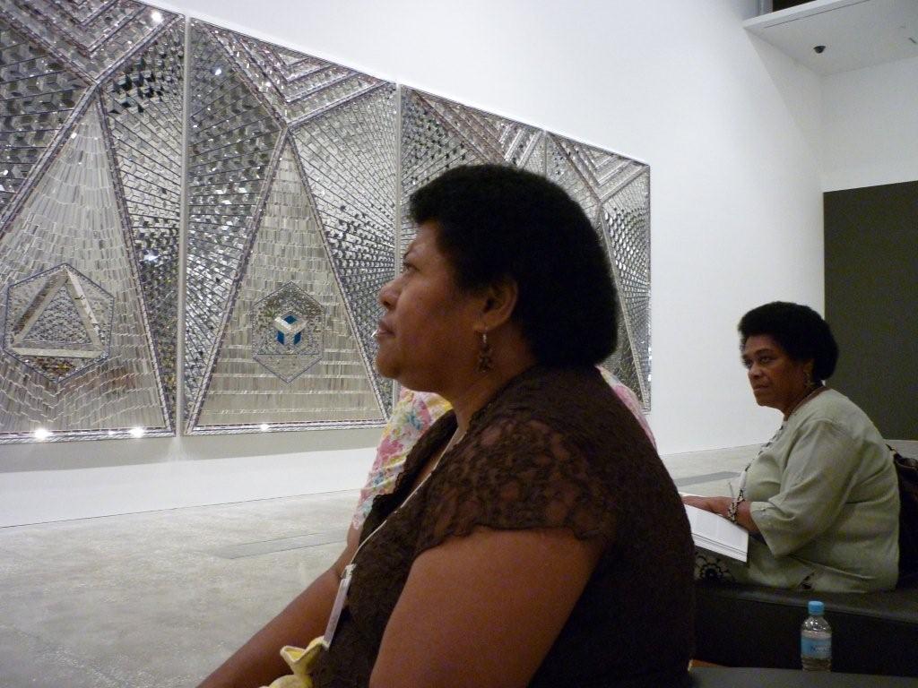 This year's Asia Pacific Triennial of Contemporary Art for the first time includes pieces by artists from Iran, North Korea, Turkey, Tibet, Cambodia, and Myanmar. Here, Bale Jione and Leba Toki of Fiji view the work of prominent Iranian artist Monir Shahroudy Farmanfarmaian.
