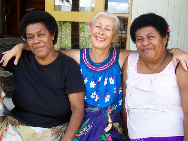 Fijian artists Leba Toki and Bale Jione flank Robin White as the trio poses during a break from their work on the exquisite bark-cloth art commissioned for the exhibition known as "APT6."