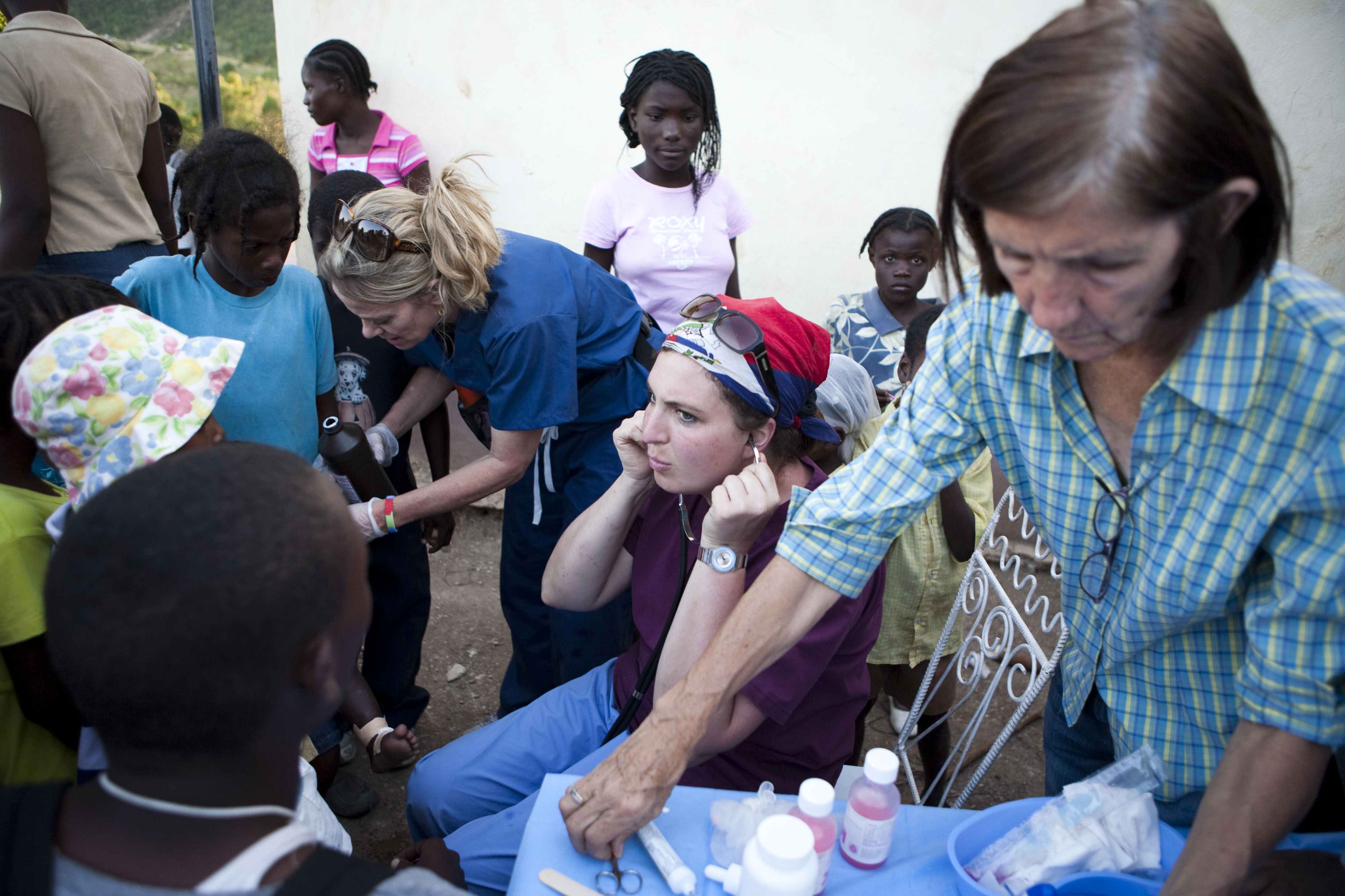 Susanna Puzo, right, is a long-time resident of Haiti who helped the medical team and provided key translation assistance. The official languages of the country are Haitian Creole and French.