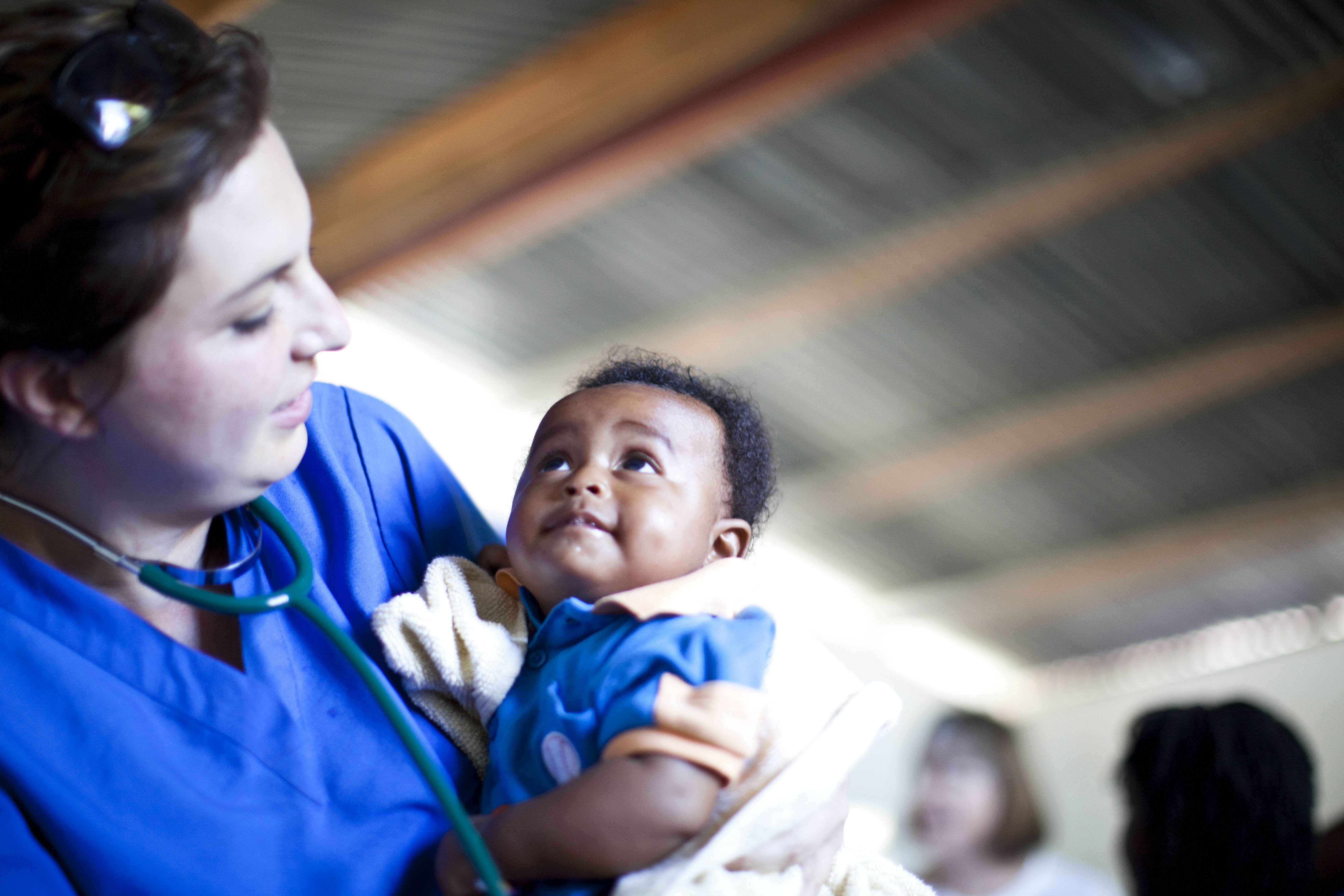 The faces of the children and the hopeful spirit of the adults were a constant source of inspiration to the visiting doctors. "We would meet people whose entire family had been killed and their house destroyed. Yet they would just pick up and carry on," said Dr. Munirih Tahzib, shown here with a young patient.