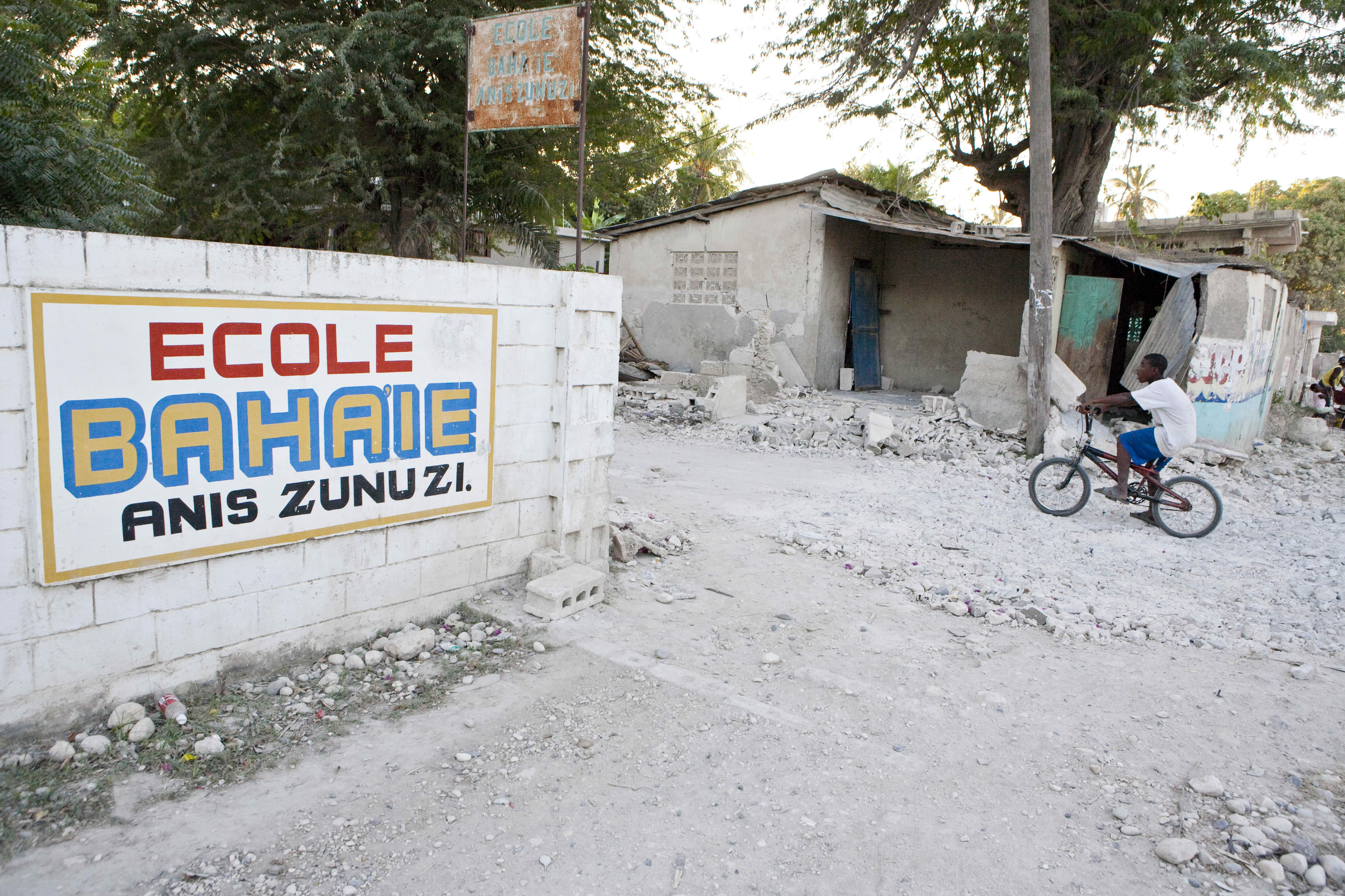 The medical team used the Anis Zunuzi Baha'i School on the outskirts of Port-au-Prince both as its headquarters and the site of a makeshift clinic. The visitors camped out in the schoolyard with others who were staying there because they had lost their homes.