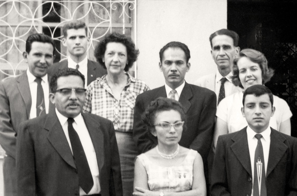 The first National Spiritual Assembly of El Salvador was elected in 1961. All nine members appear in this official photograph. In back from left are Napoleon Gonzalez, Quentin Farrand, Marcia Steward de Matamoros, Rafael Garcia, Marco Antonio Martinez, and Jeanne de Farrand. In front, Jose Maria Padilla, Marta de Herrador, and Gabriel Torres.
